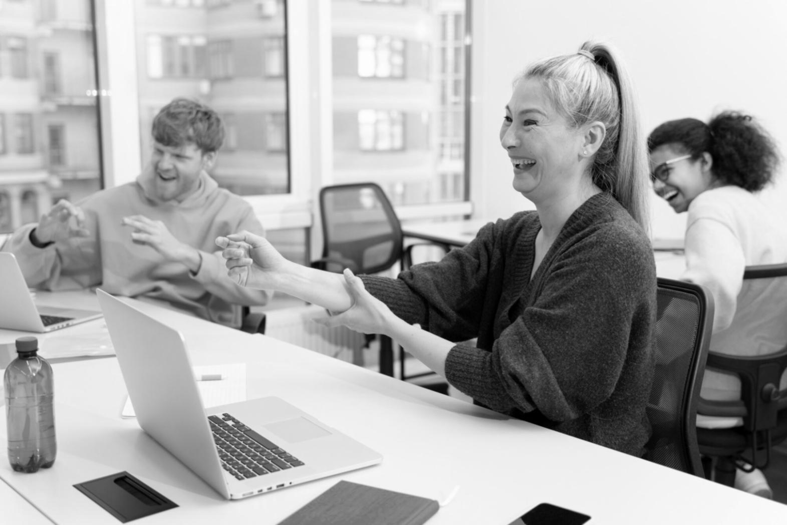Professional engaged in financial scenario analysis at desk